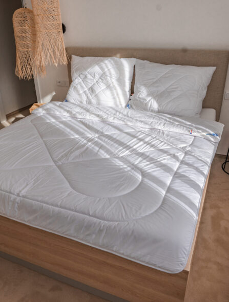 Přikrývky a polštáře